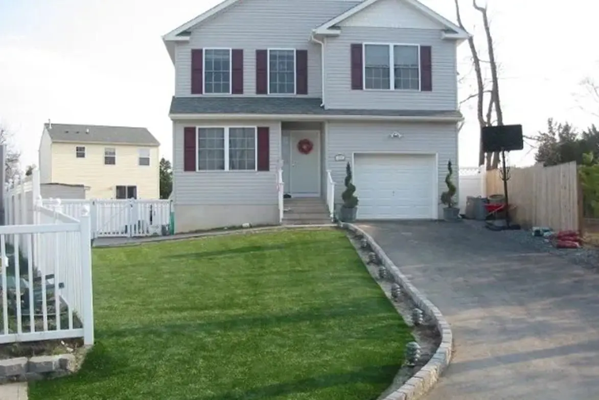 A house with a lawn in front of it